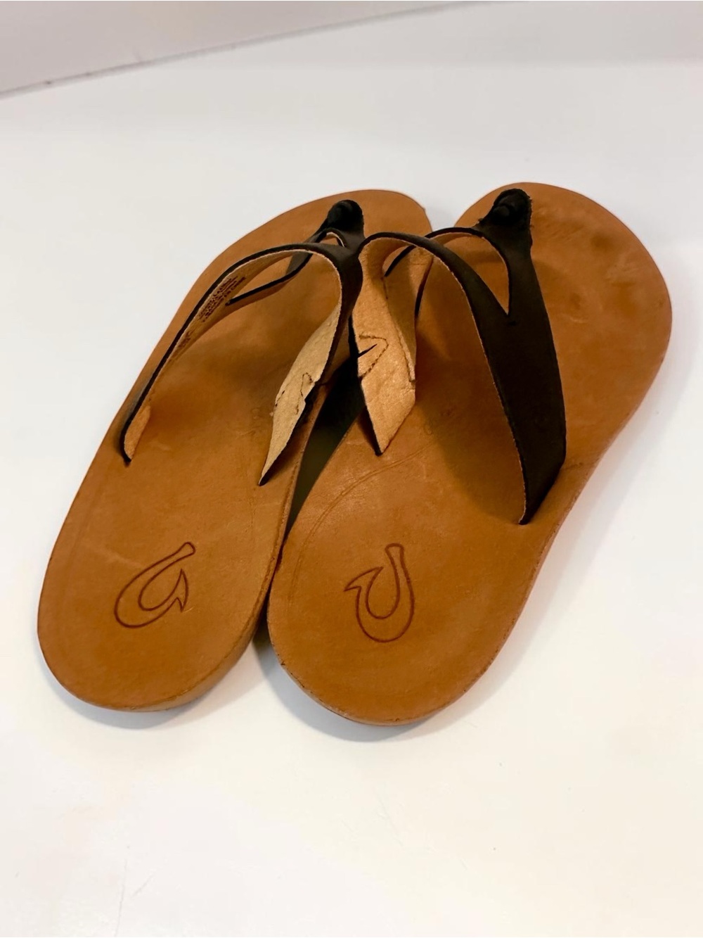 OluKai Black Leather Toe-Post Sandals with Tan Footbed - Picture 2 of 7
